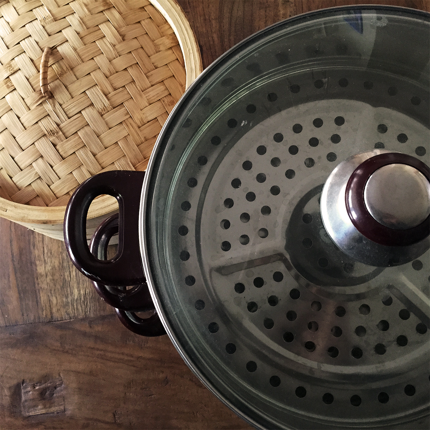 Steamer Baskets choices - bamboo or stainless steel. Bamboo imparts flavor, stainless does not.