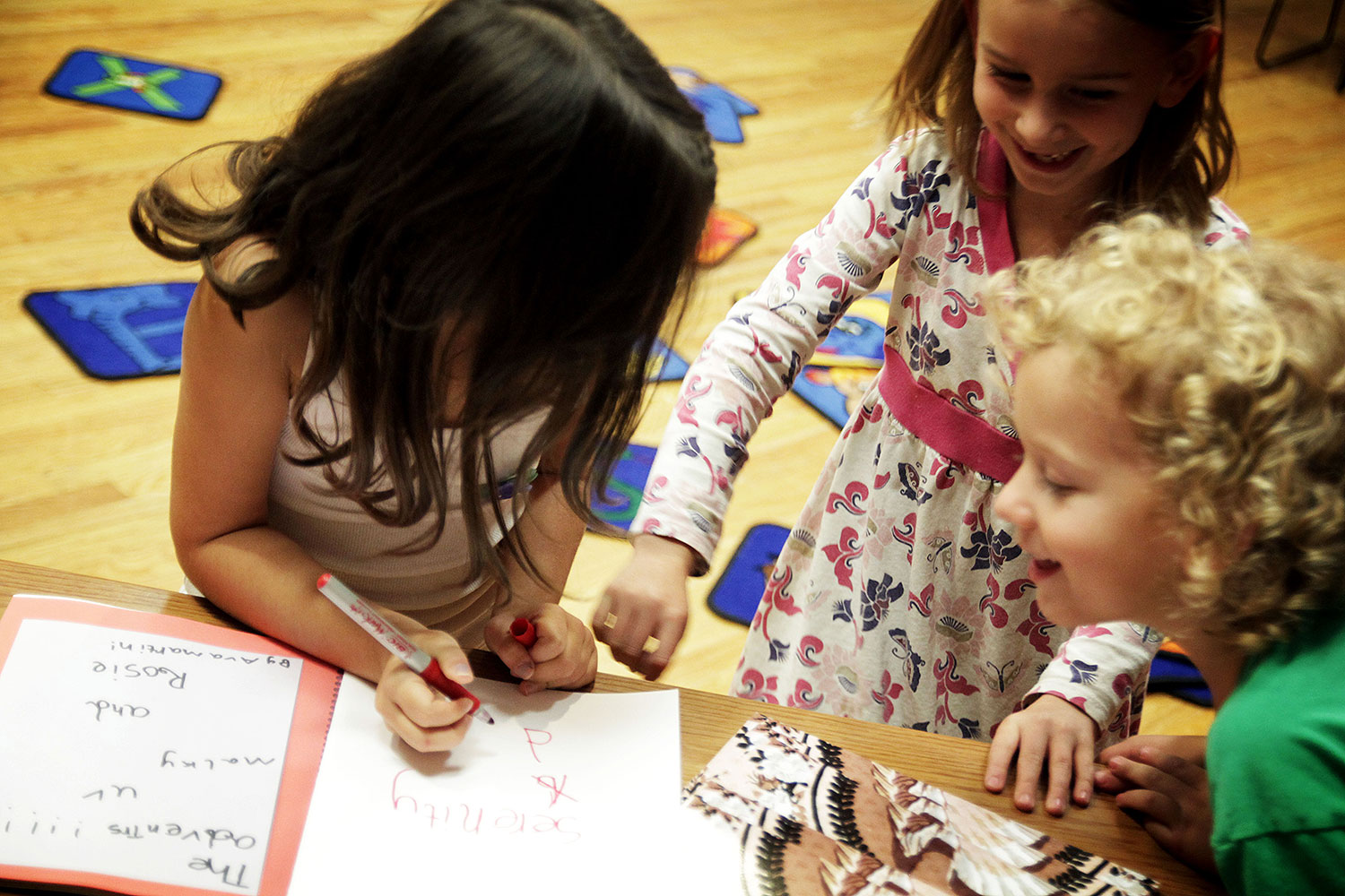 A childs book signing (Book writing for children: Laying foundations for peace)