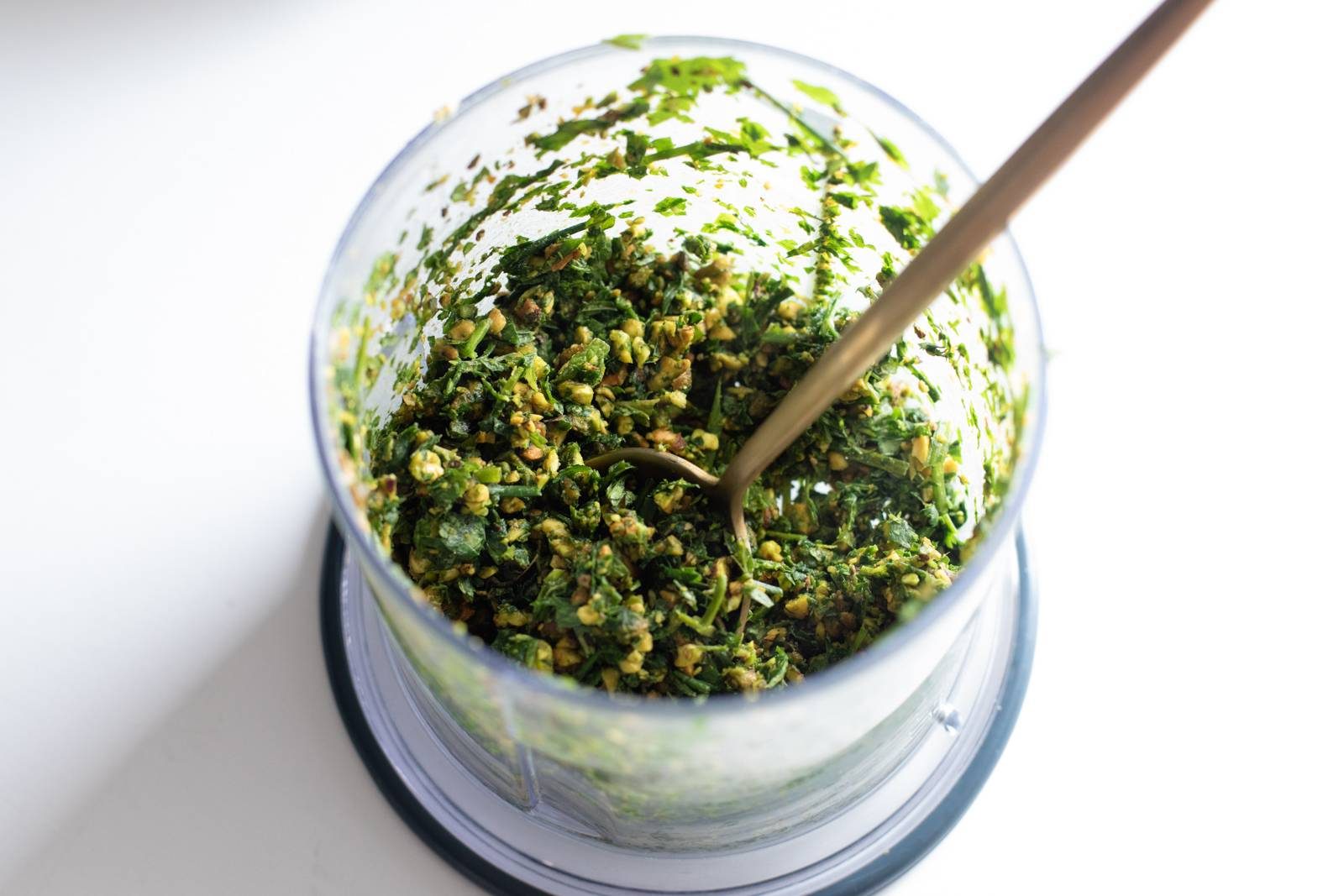 Chopping up sauce in a mini chopper.