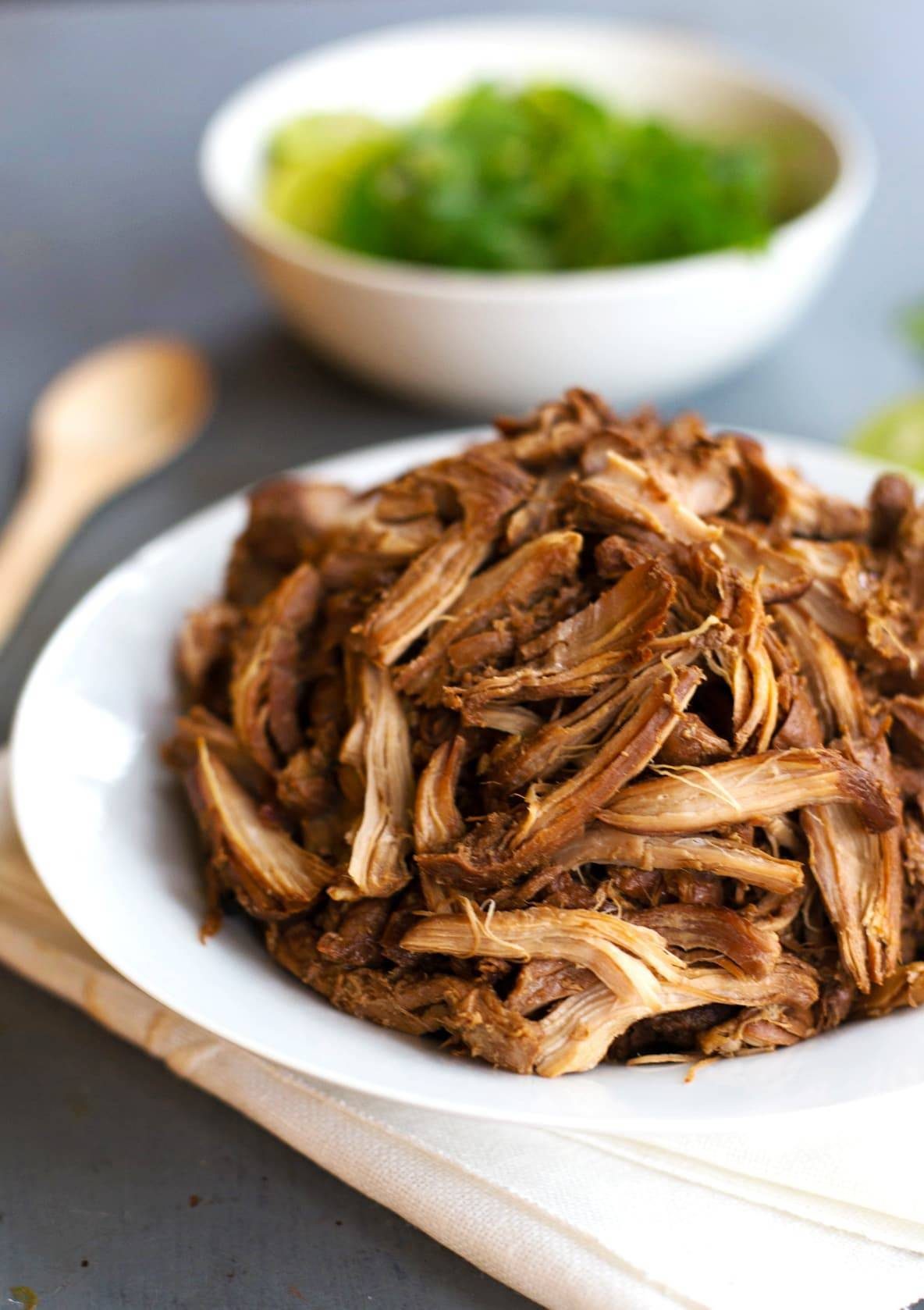 Honey Glazed Crockpot Chicken Adobo on a white plate.