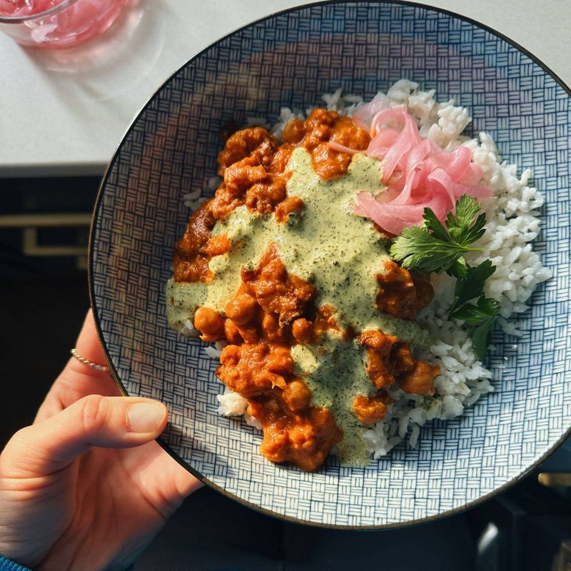 A picture of Butter Cauliflower and Chickpeas with Mint Cilantro Sauce