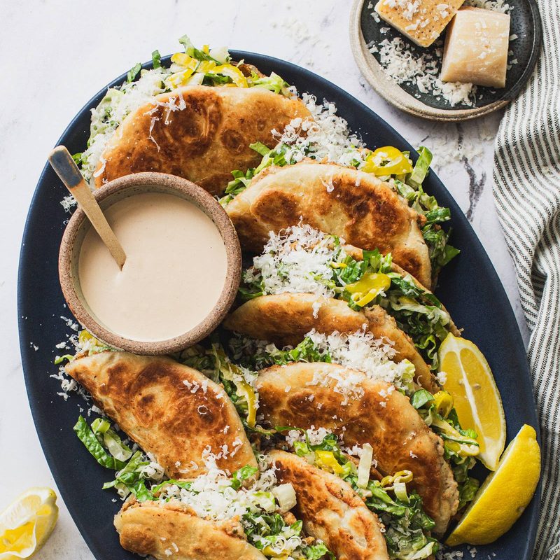 Caesar smash tacos on a plate.